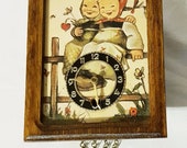 Small wooden Hummel Germany wind up pendulum clock (missing key pendulum) framed picture of 2 children on a fence 3.75 quot 4.75 quot