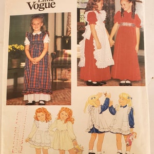 Little Vogue Pattern #2823 uncut sewing pattern for children&#39;s high waisted dress with back zip & ruffled pinafore in 2 lengths size 3