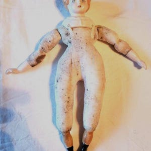 Antique German china head doll with intact china hands feet stuffed cloth body blonde flat top hairstyle no clothing 13.5&quot; minor paint loss