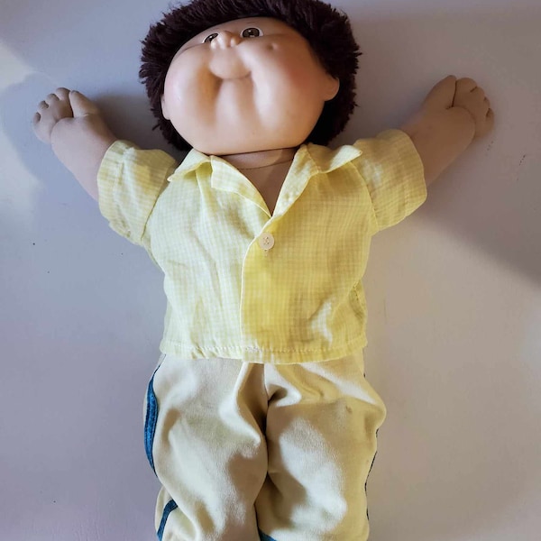 Vintage 1986 Coleco Cabbage Patch Kid dressed in yellow pants & short sleeved check shirt brown short straight spiky hair brown eyes