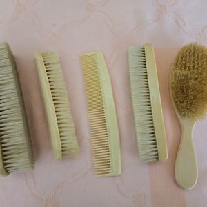 4 vintage unidentified early-mid century ivory coloured celluloid brushes with soft bristles, personal care items, plus Fuller Canada comb