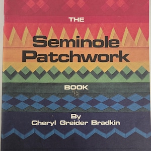 May include: The cover of "The Seminole Patchwork Book" displays a vibrant design. The title is prominently displayed, with the author's name and publisher's details below. The cover showcases a patchwork design in shades of red, orange, yellow, green, blue, and navy.