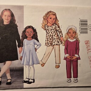 May include: A sewing pattern for girls' dresses and a trouser set. The pattern includes three different styles: a black dress with fur trim, a blue dress with a gathered skirt, and a pink trouser set with a white fur trim. The pattern is from Butterick and is labelled "Final Sale".