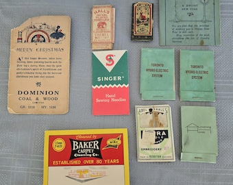May include: A collection of vintage paper ephemera including matchbook covers and needle packets. Items feature various brand names and graphics such as Dominion Coal & Wood, Singer Hand Sewing Needles, Baker Carpet Cleaning Co., and Toronto Hydro-Electric System.