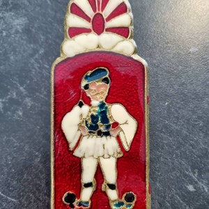 Brass & enamel letter clip souvenir of Greece with a man in national costume on 1 side map of Greece on the other 4.5&quot; long opens to 2&quot;