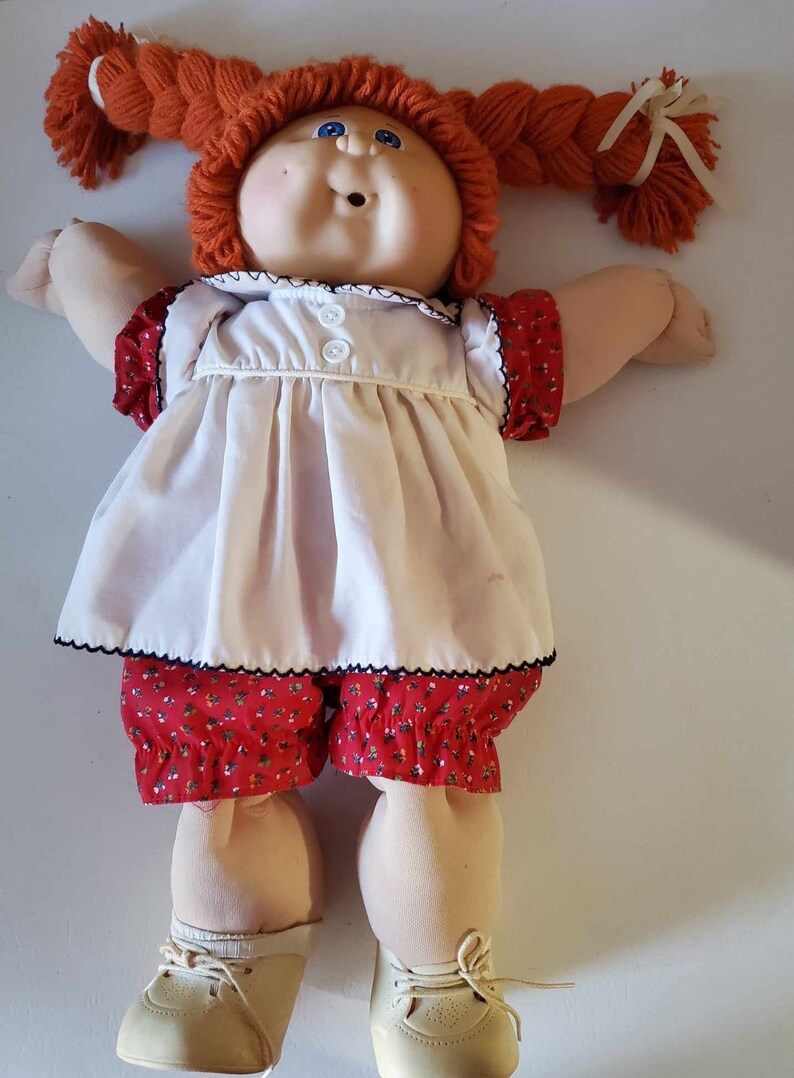 Vintage 1984 Coleco Cabbage Patch Kid original outfit dress & panties, shoes, 1 sock, orange yarn hair in braids, white skin, blue eyes image 1