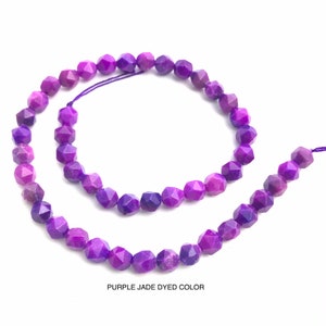 May include: Strands of faceted, purple jade beads. The beads are strung on a purple cord and are a deep, rich purple color. The text "PURPLE JADE DYED COLOR" is at the bottom of the image.