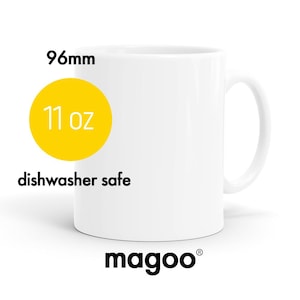 May include: White ceramic mug with a yellow circle that says "11 oz" and "96mm". The mug also says "dishwasher safe" and "magoo" at the bottom.