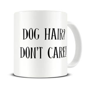 May include: White ceramic coffee mug with black text that reads "DOG HAIR? DON'T CARE!"