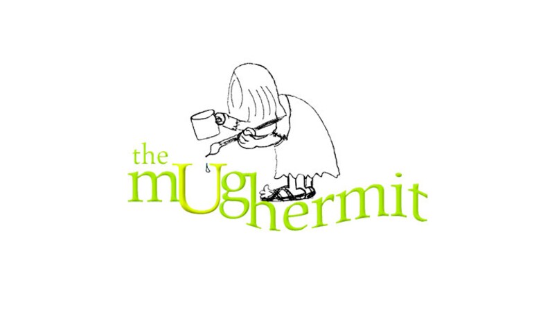 May include: A black and white illustration of a person painting the words "the mug hermit" in green. The person is wearing a long robe and sandals.