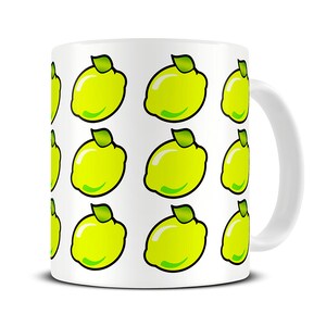 May include: White ceramic mug with a repeating pattern of yellow lemons with green leaves.
