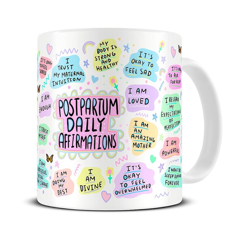 May include: White ceramic mug with colorful illustrations and text that reads "Postpartum Daily Affirmations". The text includes phrases like "I am enough", "I am loved", "I am an amazing mother", and "I am powerful".