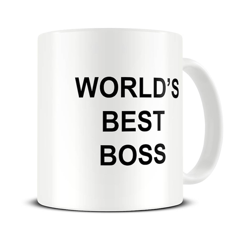 May include: White ceramic mug with the text "WORLD'S BEST BOSS" in bold black letters. The mug has a curved handle and a glossy finish, suitable for hot or cold beverages.
