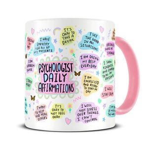 May include: White ceramic mug with a pink handle. The mug features a colorful design with the text "Psychologist Daily Affirmations" and various positive affirmations.