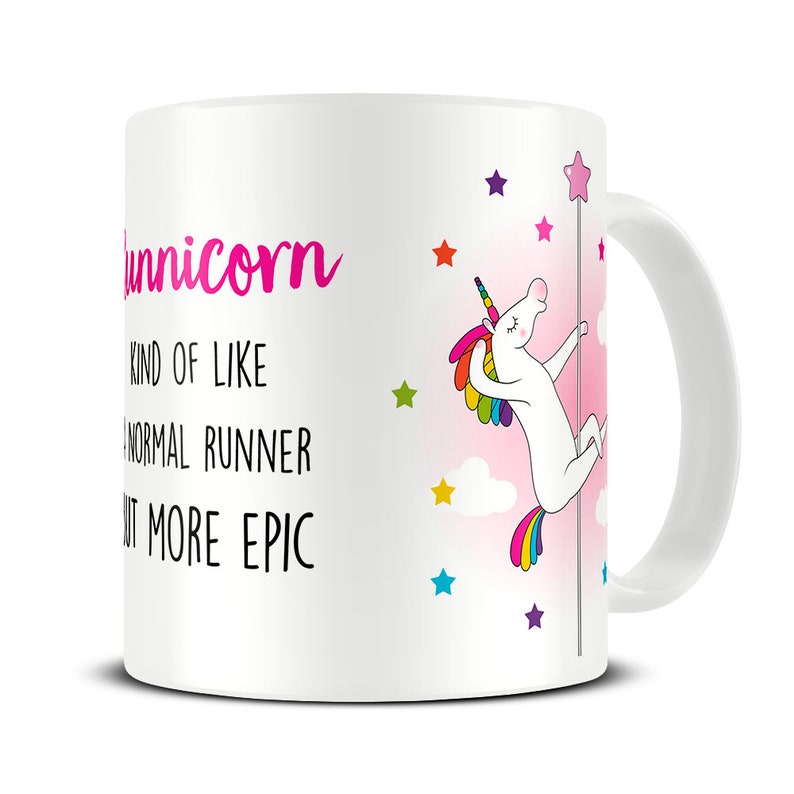 May include: White ceramic mug with the word "Runnicorn" in pink script. The mug features a cartoon unicorn with a rainbow mane and tail, pole dancing. Text on the mug reads "Kind of like a normal runner but more epic."