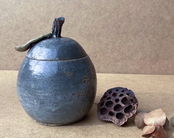 Mauve raku ceramic box in the shape of a fruit. Succumb to the allure of this forbidden but useful fruit to hold your little treasures.