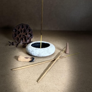 Awaken your senses with this 4-in-1 raku ceramic incense holder, designed to hold incense, Palo Santo or a candle