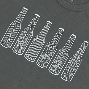 May include: A dark gray t-shirt with a white design of seven circuit board beer bottles.