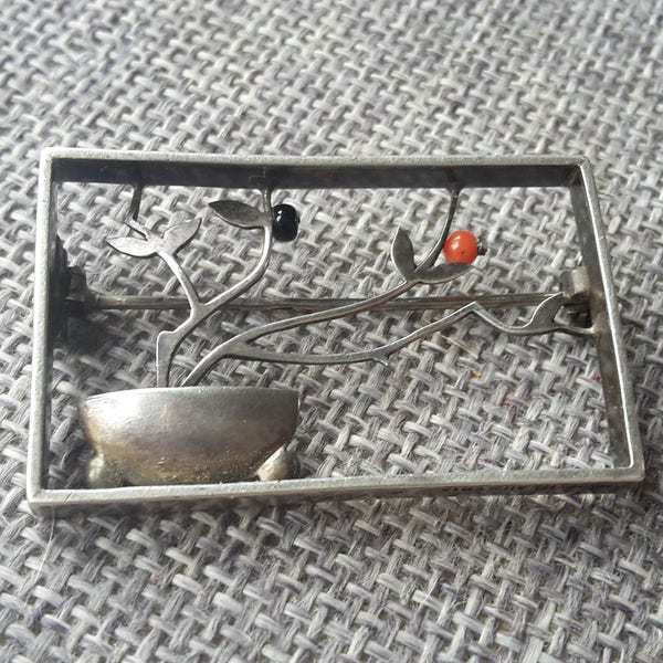 This is a rare quality vintage Art deco silver coral and onyx brooch by WILHELM KUNZ c1925