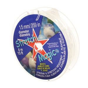 May include: A spool of clear elastic stretch magic bead and jewelry cord. The spool is labeled "Stretch Magic" and has the following information: 1.5 mm/.059 in diameter, 4 m/13 ft, Strong & Stretchy/Resistant & Flexible, Bead & Jewelry Cord, Cable de Bolás y Joyas, Cordón para Cuentas & Joyería/Fuerte & Flexible.