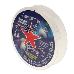 May include: A spool of clear Stretch Magic bead and jewellery cord. The diameter is 0.7 mm, and the cord is 5 metres long. The label features a red star and the words "Magic" and "Stretch".