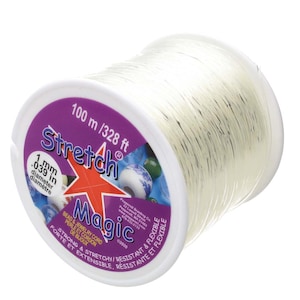 May include: A spool of clear elastic stretch magic bead and jewellery cord, 100 metres or 328 feet long, with a 1 mm or 0.39 inch diameter. The spool is labelled "Stretch Magic" and "Strong & Stretchy/Resistant & Flexible".
