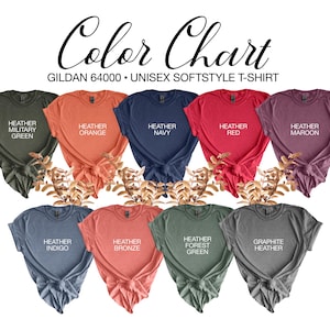 May include: A color chart displaying nine Gildan 64000 unisex softstyle t-shirts in various colors. The colors include Heather Military Green, Orange, Navy, Red, Maroon, Indigo, Bronze, Forest Green, and Graphite Heather. The text "Color Chart" is at the top.