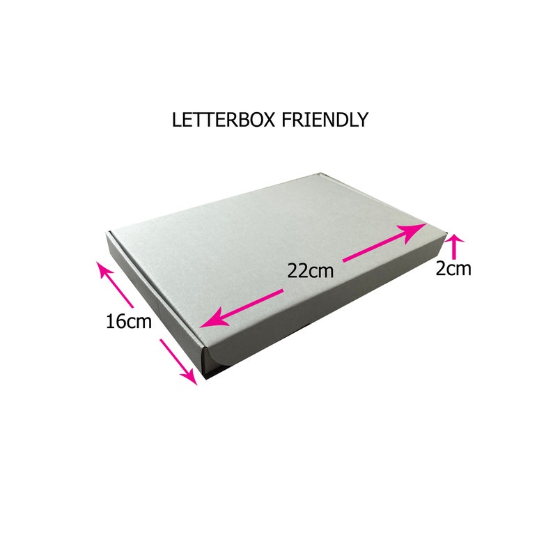 May include: A white cardboard box with the text "LETTERBOX FRIENDLY" printed on the top. The box is 22 cm long, 16 cm wide, and 2 cm high.