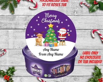 May include: Purple and white personalized Christmas label with a reindeer, Santa Claus, and a Christmas tree. The label says "Merry Christmas" and "Any Name From Any Name".