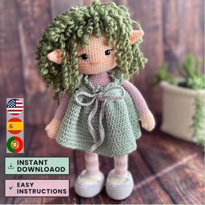 May include: Crochet pattern for a green-haired elf doll wearing a green dress with a pink bodice and white shoes. The pattern includes easy instructions and is available for instant download.