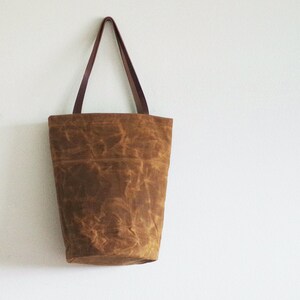Waxed canvas tote bag with leather handles and round bottom image 2