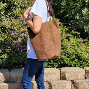 Waxed canvas tote bag with leather handles and round bottom image 1