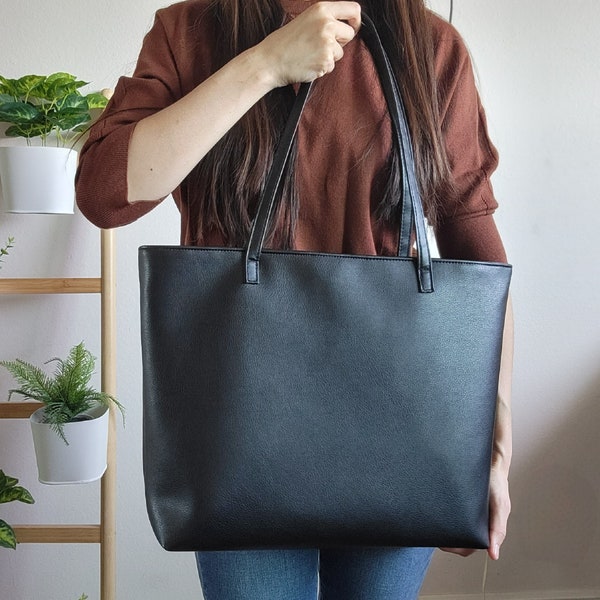 Black leather tote bag with zipper