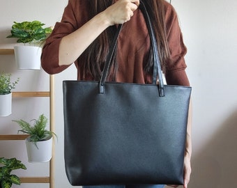 Black leather tote bag with zipper