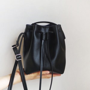 Tiny black vegan leather bucket bag