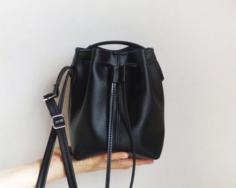 Tiny black vegan leather bucket bag