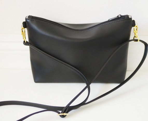 black crossbody bag with gold hardware