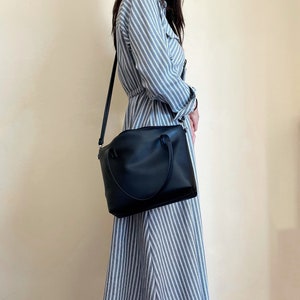 Black leather crossbody tote bag