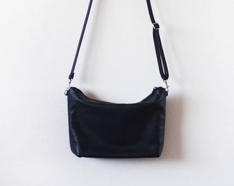 Large black leather crossbody bag with zipper