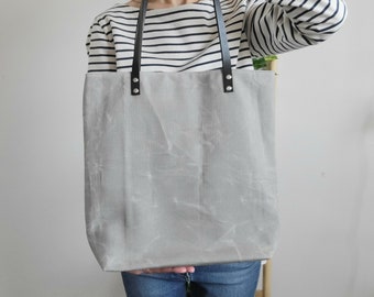 Waxed canvas tote bag with leather handles