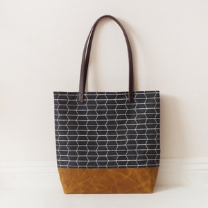 Large printed waxed canvas tote bag with leather handle