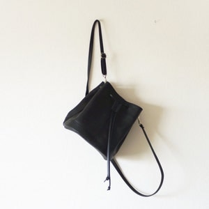 Mini convertible black leather bucket bag crossbody and backpack