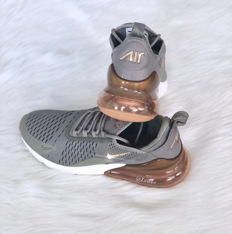 Swarovski Nike Air Max 270 Shoes Dark StuccoMetallic GoldSail customized with Swarovski Crystals. Swarovski Nike Air Max 270 Shoes Dark StuccoMetallic GoldSail customized with Swarovski Crystals.