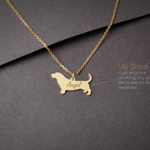 May include: A gold necklace with a basset hound pendant. The pendant is engraved with the name "Angel". 14k Gold. I can engrave anything you would like to see on the necklace.