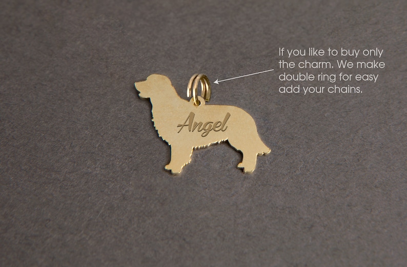 May include: Gold-colored dog charm with the name "Angel" engraved on it. The charm has a double ring for attaching to a chain.