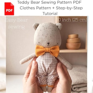 May include: A handmade teddy bear doll, approximately 10 inches (25 cm) tall, with a gray body, orange bow tie, and checkered pants. The image includes text: "Teddy Bear Sewing Pattern PDF Clothes Pattern + Step-by-Step Tutorial".