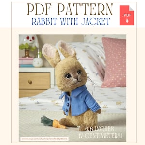 May include: A plush rabbit wearing a blue jacket, holding a carrot and a green brush. The text "PDF PATTERN RABBIT WITH JACKET" is at the top. The rabbit is 6.6 inches (17 centimeters) tall.