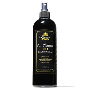 May include: A black bottle of Lana's Fur Cleaner, a 3-in-1 product that cleans, glazes, and deodorizes fur. The bottle is labelled with gold lettering and a crown logo. It is non-toxic, made with 100% natural ingredients, and contains no added chemicals. The bottle is 475 ml.
