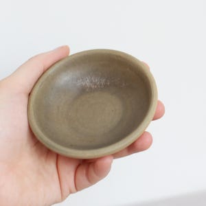 Tiny olive green ceramic bowl