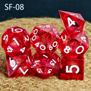 May include: A collection of red, multi-sided dice with white numerals. The dice are transparent, showing a glittery interior. The text "SF-08" is in the upper left corner. Ideal for role-playing games.